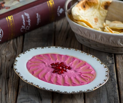 beetroot hummus served in a dish isolated on wooden background side view of appetizer photo