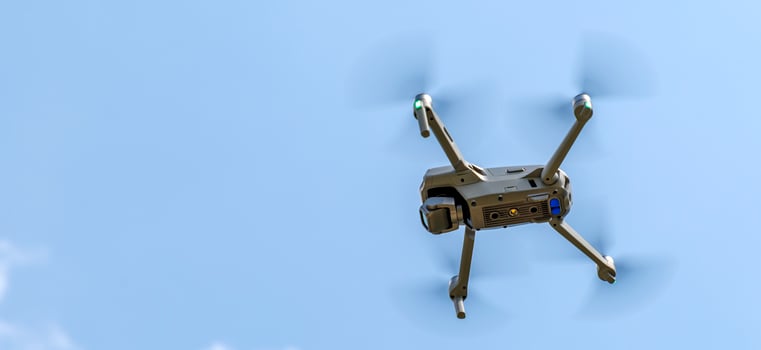 Panoramic view of a flying drone against a blue sky photo