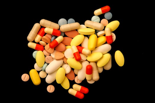 Many different colorful medications and pills. A pile of various multicolored drugs. photo