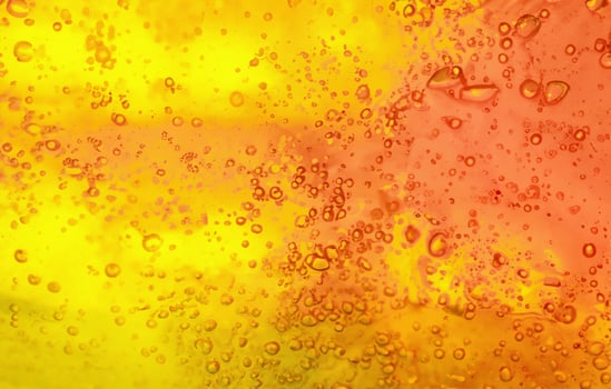 Bubbling Brilliance, Vibrant Gel Background with Abstract Texture in Yellow and Orange. photo