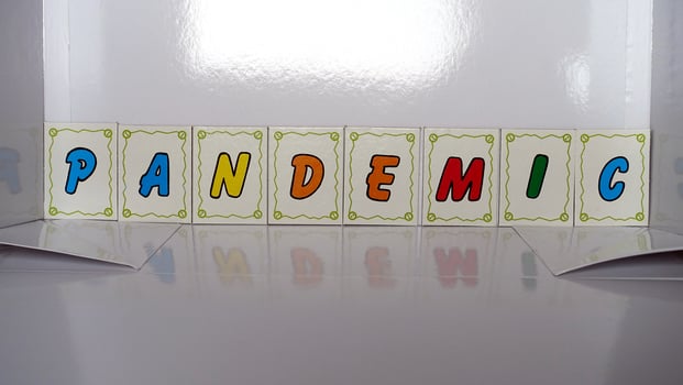 pandemic composed with colored cardboard letters photo