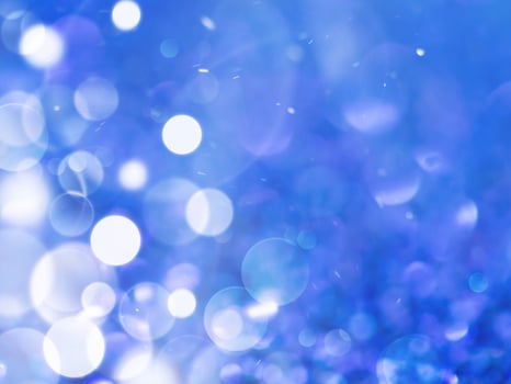 Blue sparkling glitter bokeh background. photo