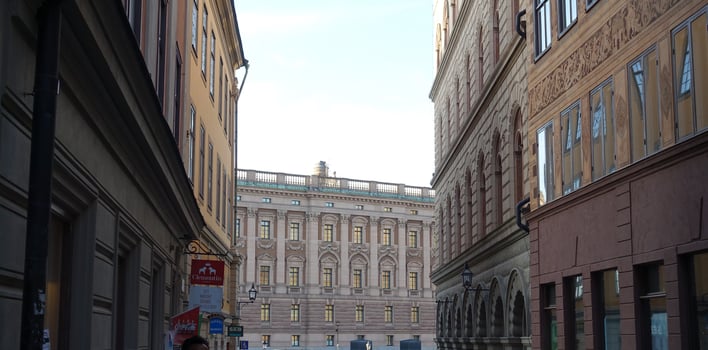 walking in the historic center of Stockholm. You can see the construction site cranes and a hot air balloon. photo