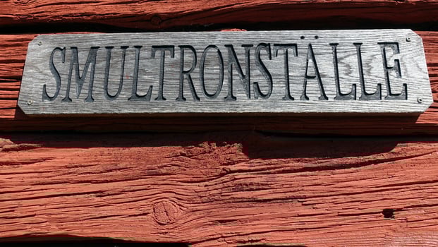 a sign in Scandinavia indicating a place of the Wild Strawberries photo