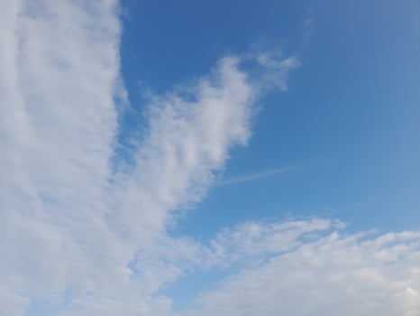 The white clouds on the blue sky are perfect for the background. Skyscape on Lombok Island, Indonesia photo
