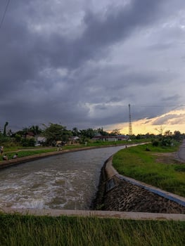 Irrigation water flow, evening, twilight landscape photo