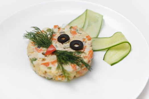 baby salad laid out in the form of a bunny on the plate photo