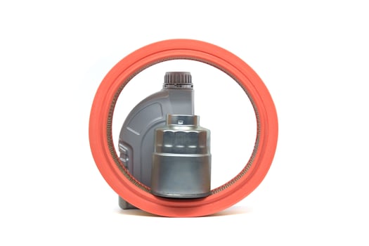 Orange air filter, oil canister and oil filter isolated on white photo