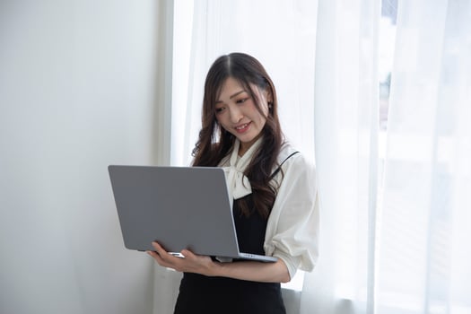 A working Japanese woman by remote work in the home office closeup photo