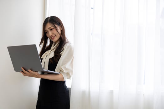 A working Japanese woman by remote work in the home office closeup photo