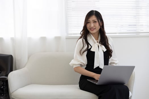 A working Japanese woman by remote work in the home office closeup photo
