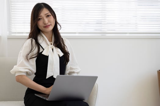A working Japanese woman by remote work in the home office closeup photo