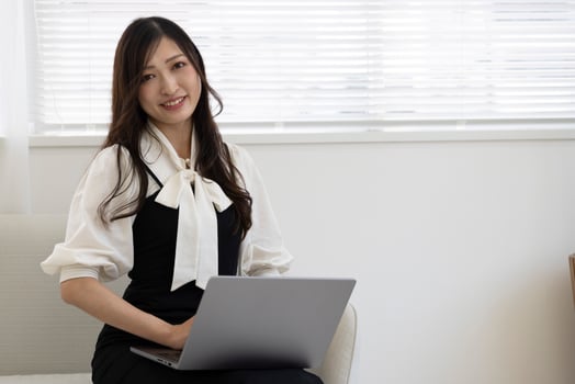 A working Japanese woman by remote work in the home office closeup photo