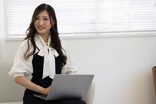 A working Japanese woman by remote work in the home office closeup photo