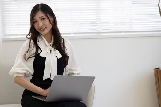 A working Japanese woman by remote work in the home office closeup photo