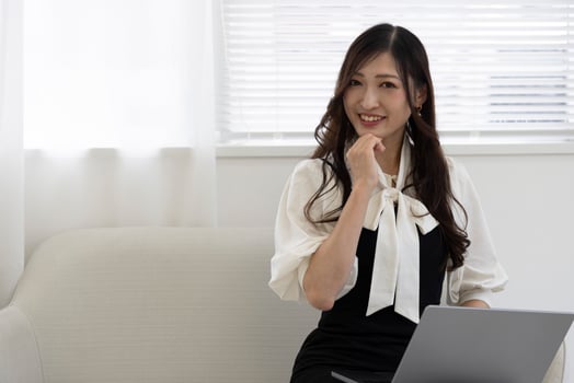A working Japanese woman by remote work in the home office closeup photo