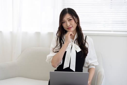 A working Japanese woman by remote work in the home office closeup photo