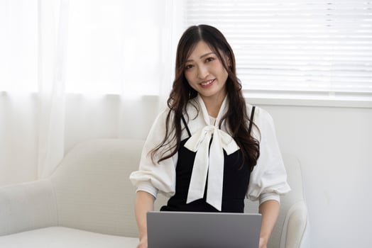A working Japanese woman by remote work in the home office closeup photo