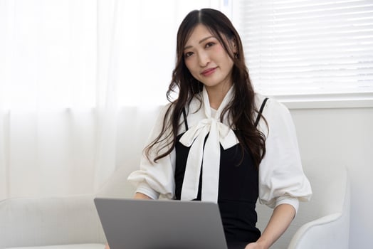 A working Japanese woman by remote work in the home office closeup photo