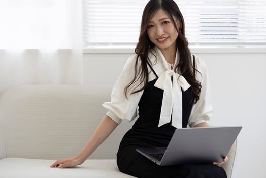 A working Japanese woman by remote work in the home office closeup photo
