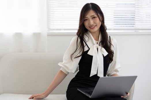 A working Japanese woman by remote work in the home office closeup photo