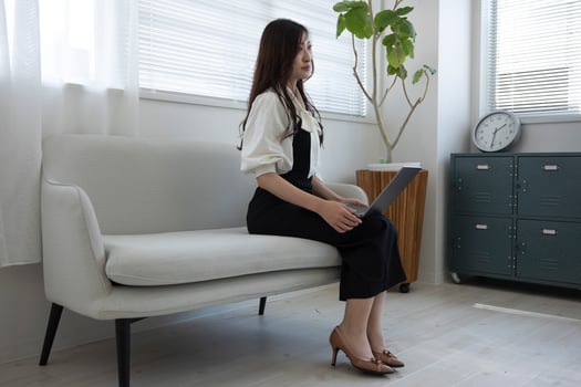 A Japanese woman checking smartphone by remote work in the home office photo