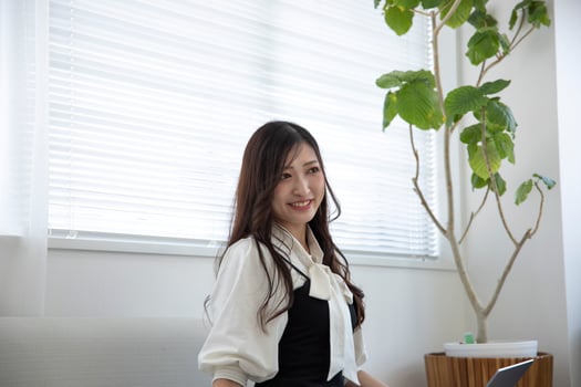 A relaxed Japanese woman by remote work in the home office photo