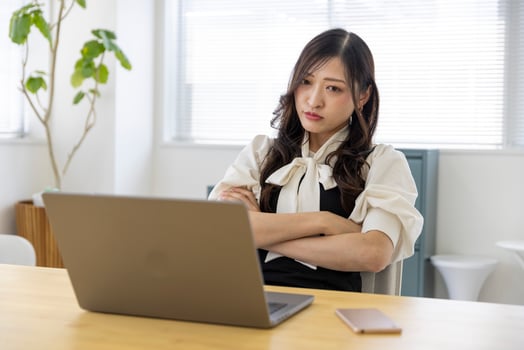 A worried Japanese woman by remote work in the small office photo