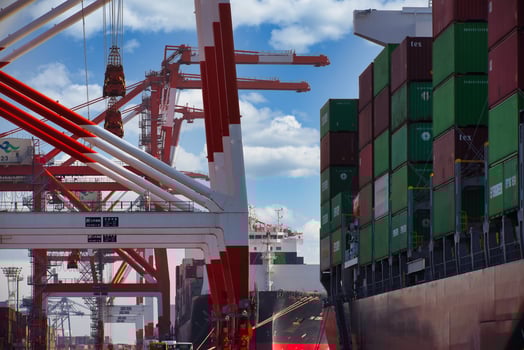 Containers and cranes near the port in Aomi Tokyo telephoto shot photo