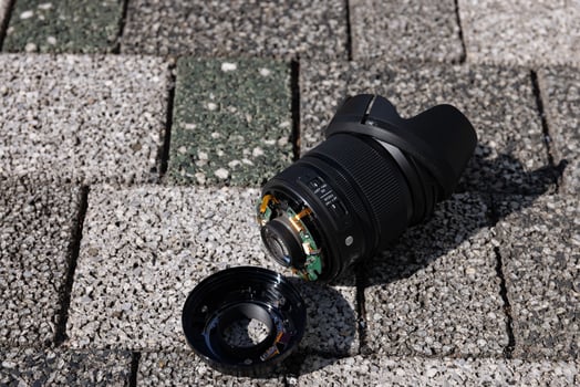 A broken lens on the street sunny day handheld photo