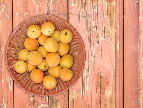 Apricots On The Wooden Background photo