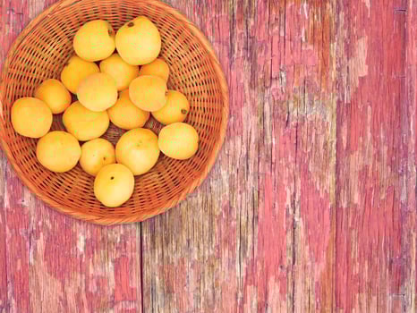 Apricots On The Wooden Background photo