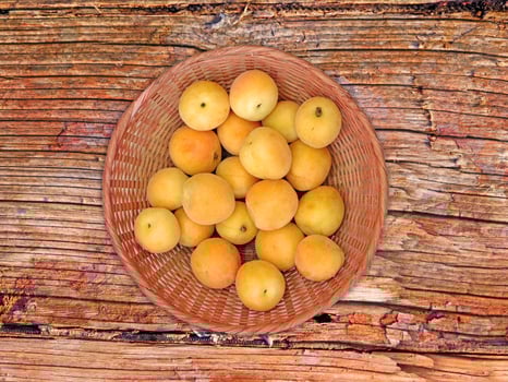 Apricots On The Wooden Background photo