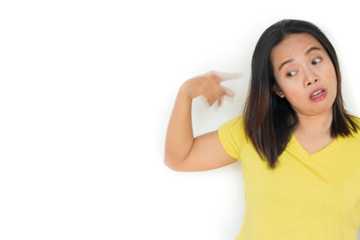 Portrait of an angry woman looking at camera isolated on a white background photo