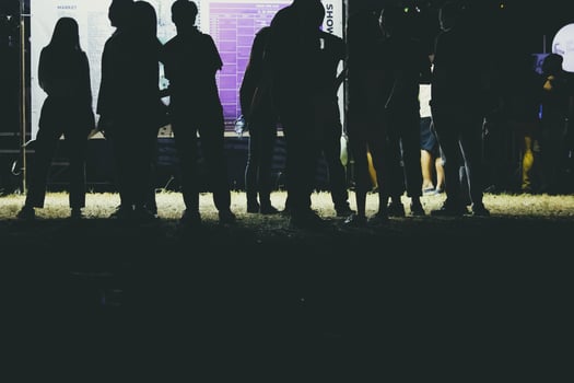 Human legs of people which waiting for music festival. photo
