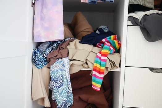 rawer with messy cloths top view , photo