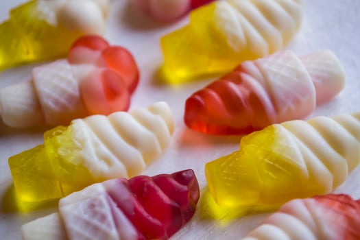Bright candies on a white background, close up. photo