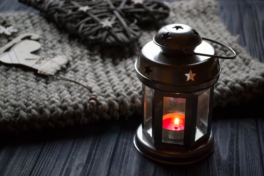 Metal candle lantern in a cozy home. Details of home decor. photo
