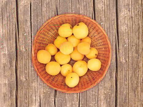 Apricots On The Wooden Background photo