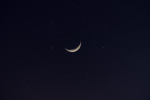Crescent moon in the dark night. photo