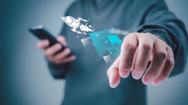Start up business concept to success, Man holding smartphone and white rocket icon is launch and soar flying out from screen with network digital technology, Finance business growth concept. photo