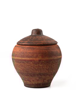 Brown ceramic pot isolated on a white background photo