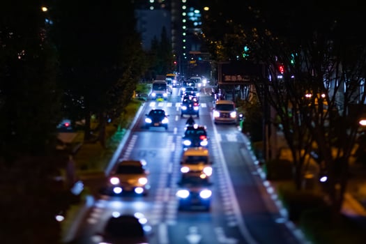 A night timelapse miniature traffic jam at the city crossing in Tokyo photo
