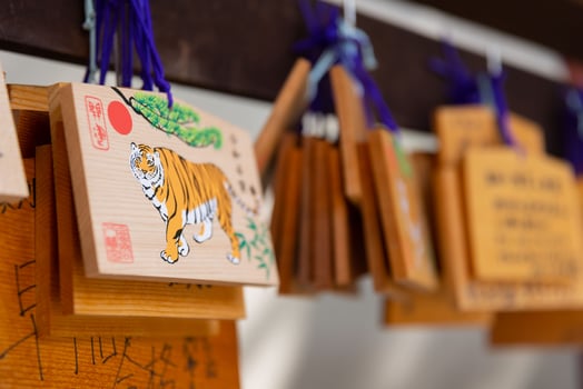 A votive wooden tablet at Tomioka Shrine close up photo