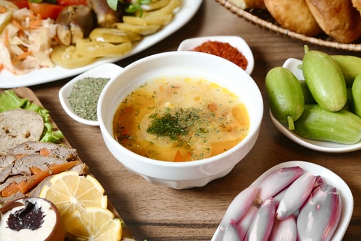 Table With Assorted Food and Soup Bowls photo