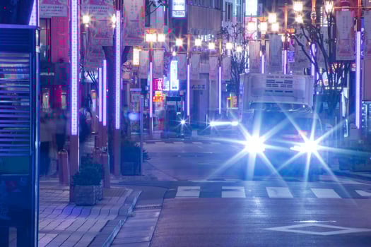 A night cityscape of the crowd at the neon town in Shinjuku Tokyo long shot photo