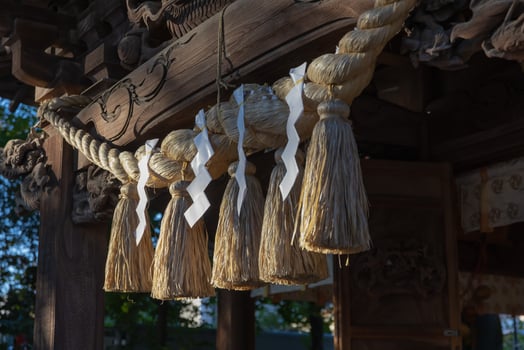 A sacred rope in front of the temple at Japanese Shrine photo