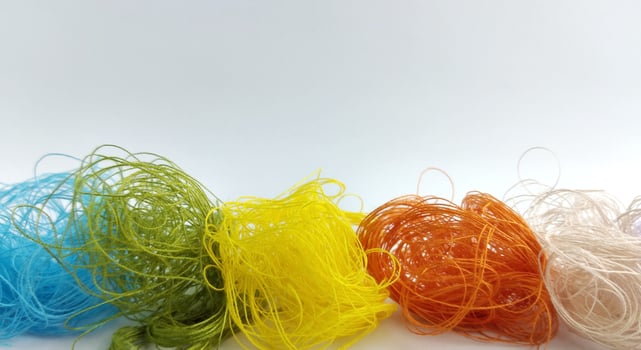 Colorful threads on a white background close-up. Selective focus. photo