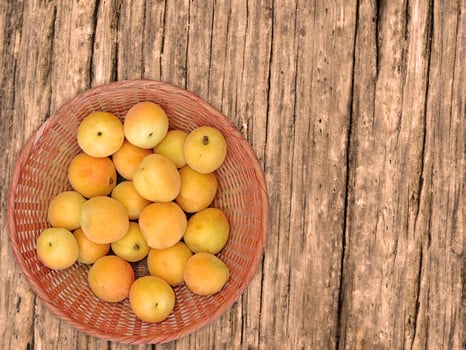 Apricots On The Wooden Background photo