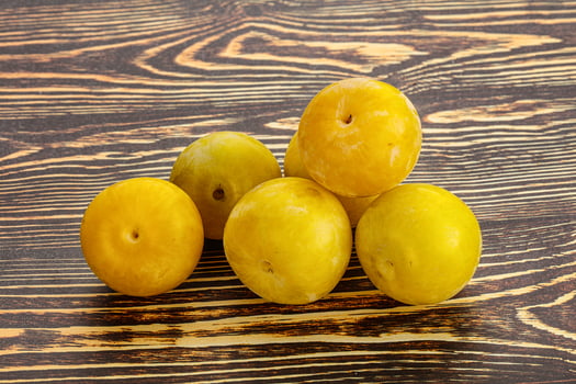 Yellow sweet plum heap fruit photo